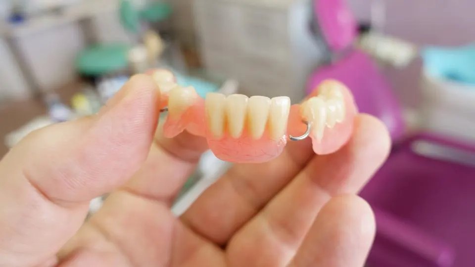 How Do You Keep a Bottom Partial Denture in Place
